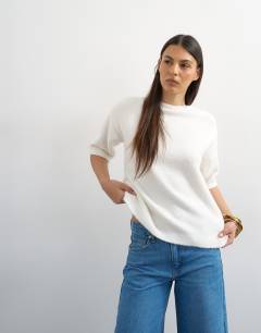 Model wearing Knitted short sleeve lace back detail jumper in ivory