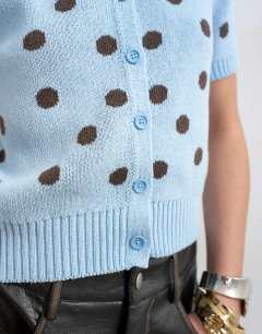 Model wearing Knitted short sleeve polka dot cardigan in blue