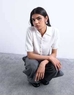 Model wearing Knitted short sleeve polo top in neutral