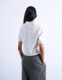 Model wearing Knitted short sleeve polo top in neutral