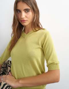 Model wearing Knitted short sleeve polo v neck top in lime