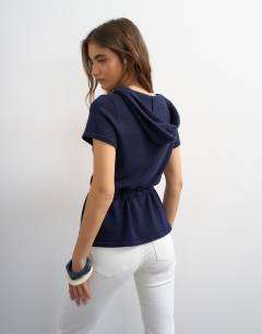 Model wearing Knitted short sleeve sporty hooded stripe cinch waist top in navy