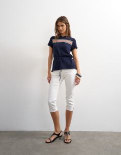 Model wearing Knitted short sleeve sporty hooded stripe cinch waist top in navy