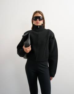 Model wearing Knitted shoulder padded seam detail jacket in black