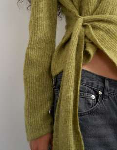Model wearing Knitted side tie jumper with wool in olive green