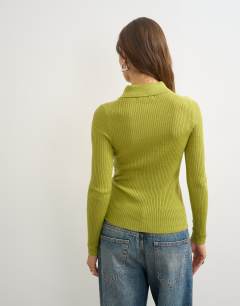 Model wearing Knitted side twist polo with wool in lime