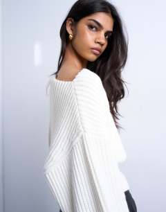 Model wearing Knitted slash neck jumper in ivory