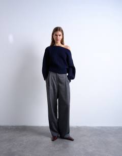 Model wearing Knitted slash neck jumper in navy