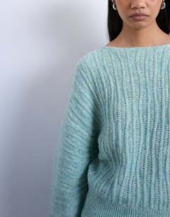 Model wearing Knitted slash neck wave textured jumper in mint