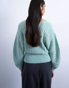 Model wearing Knitted slash neck wave textured jumper in mint