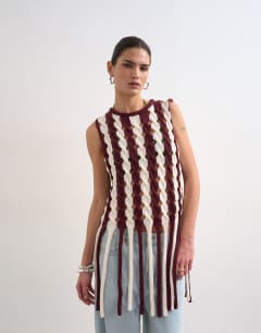 Knitted sleeveless longline knit top with tassel fringe hem in burgundy