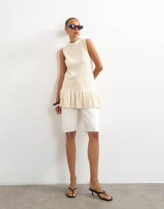 Model wearing Knitted sleeveless longline top in ecru