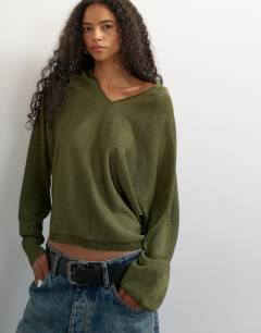 Model wearing Knitted slouchy fine knit batwing sleeve jumper in khaki