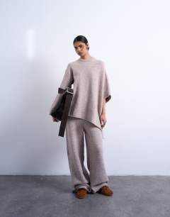 Model wearing Knitted slouchy poncho co-ord in beige