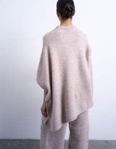 Model wearing Knitted slouchy poncho co-ord in beige