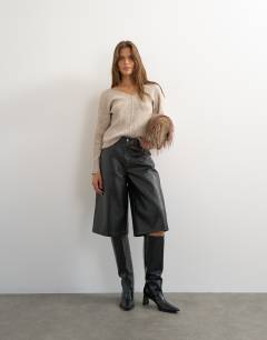 Model wearing Knitted slouchy rib jumper in oat