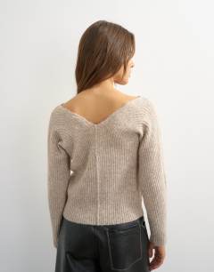 Model wearing Knitted slouchy rib jumper in oat