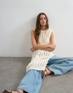 Model wearing Knitted slouchy stitchy tunic in ivory