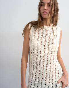Model wearing Knitted slouchy stitchy tunic in ivory