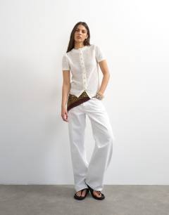 Model wearing Knitted stitchy cardigan in ecru