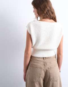Model wearing Knitted stitchy one shoulder top in cream