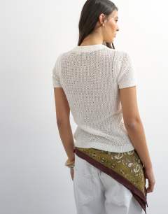 Model wearing Knitted stitchy top in ecru