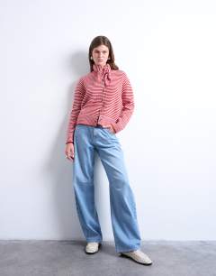Model wearing Knitted stripe cardigan and scarf in red and white