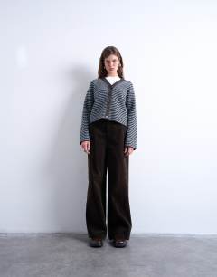 Model wearing Knitted stripe cardigan in blue