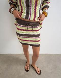 Model wearing Knitted stripe co-ord mini skirt in multi