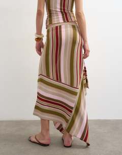 Model wearing Knitted stripe full skirt co-ord in green multi