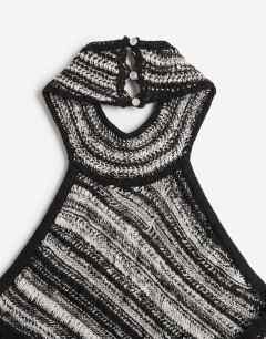 Model wearing Knitted stripe halterneck longline fringing tunic in black and white