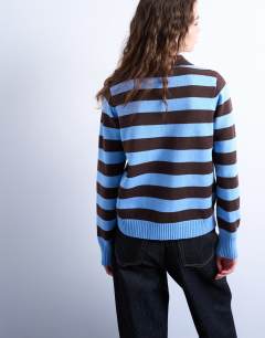 Model wearing Knitted stripe polo in blue and chocolate