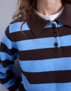 Model wearing Knitted stripe polo in blue and chocolate