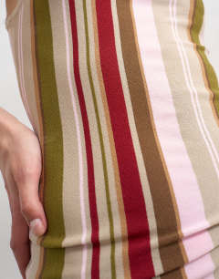 Model wearing Knitted stripe vest co-ord in green multi