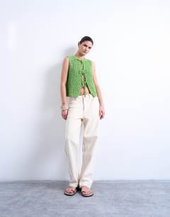 Model wearing Knitted textured tie front waistcoat in green