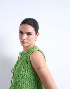 Model wearing Knitted textured tie front waistcoat in green