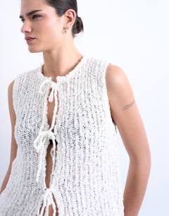 Model wearing Knitted textured tie front waistcoat in ivory