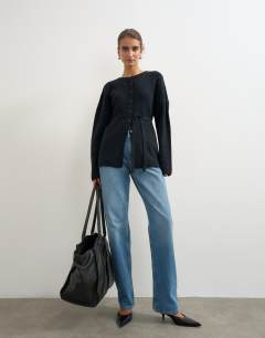 Model wearing Knitted tie back all needle cardigan in navy