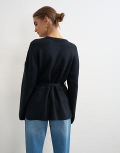 Model wearing Knitted tie back all needle cardigan in navy