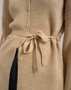 Model wearing Knitted tie back all needle cardigan in oat