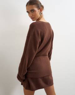 Model wearing Knitted tie front long line mini jumper dress in deep mahogany