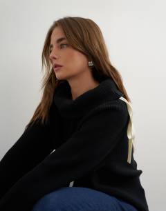 Model wearing Knitted tie funnel neck ribbed jumper in black with ivory tipping