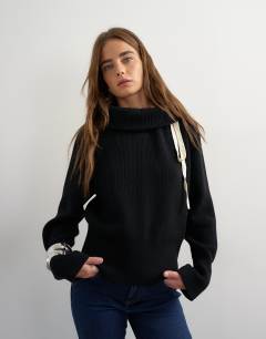 Model wearing Knitted tie funnel neck ribbed jumper in black with ivory tipping