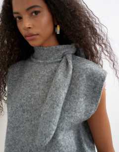 Model wearing Knitted tie neck top in grey
