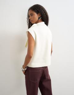 Model wearing Knitted tie neck top in ivory 