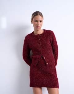 Model wearing Knitted tinsel co-ord skirt in burgundy