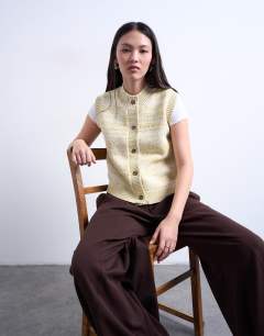 Model wearing Knitted twist yarn waistcoat in chartreuse yellow