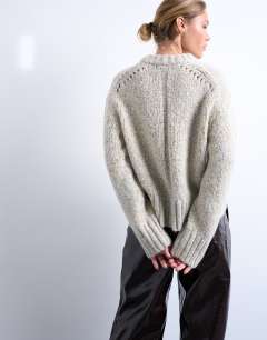 Model wearing Knitted twisted fluffy boxy jumper in blue and yellow