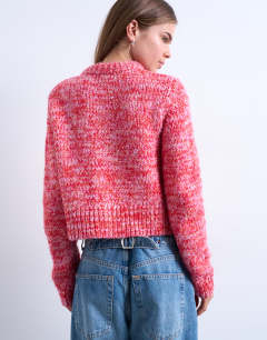 Model wearing Knitted twisted fluffy cardigan in pink