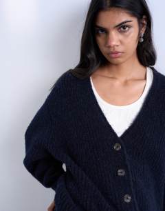 Model wearing Knitted ultimate boyfriend cardigan in Navy
